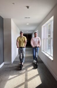 Students riding scooters